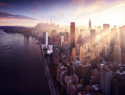 New York City - beautiful colorful sunset over manhattan fit sunbeams between buildings